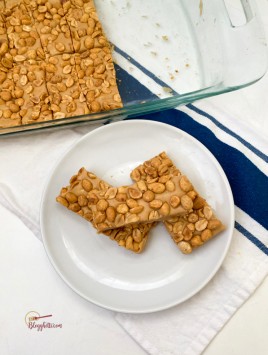 individual pay day candy bars on white plate with baking dish in background